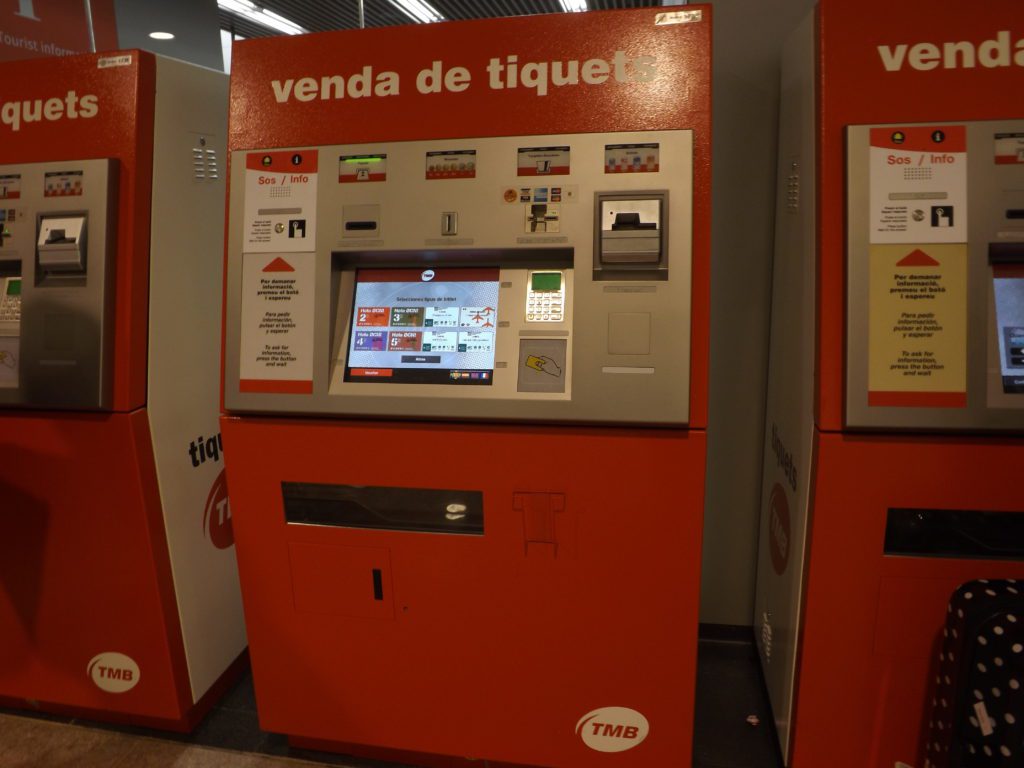 Red Barcelona Airport automated metro train ticket machines