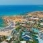 aerial view of inlets along the coastal waters of Ayia Napa and the buildings and trees on land