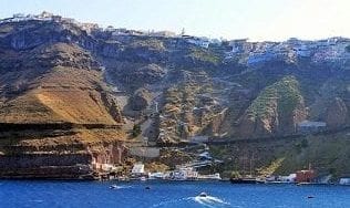 View of Santorini Old Port with the cliffs behind.