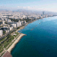 bright blue coastal water alongside the built-up city of limassol