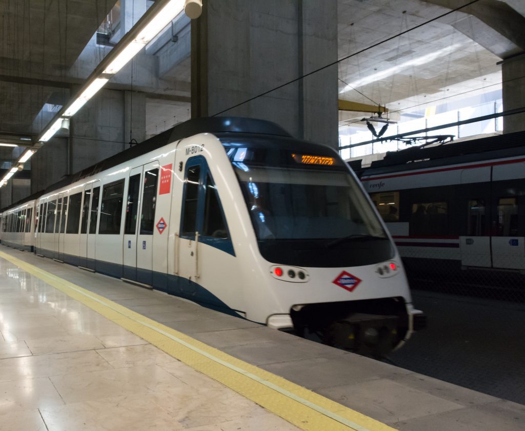 Madrid Airport metro train (line 8) arriving at the airport platform.