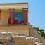 A photo of the remains of Knossos Palace ruins, with blue skies above.