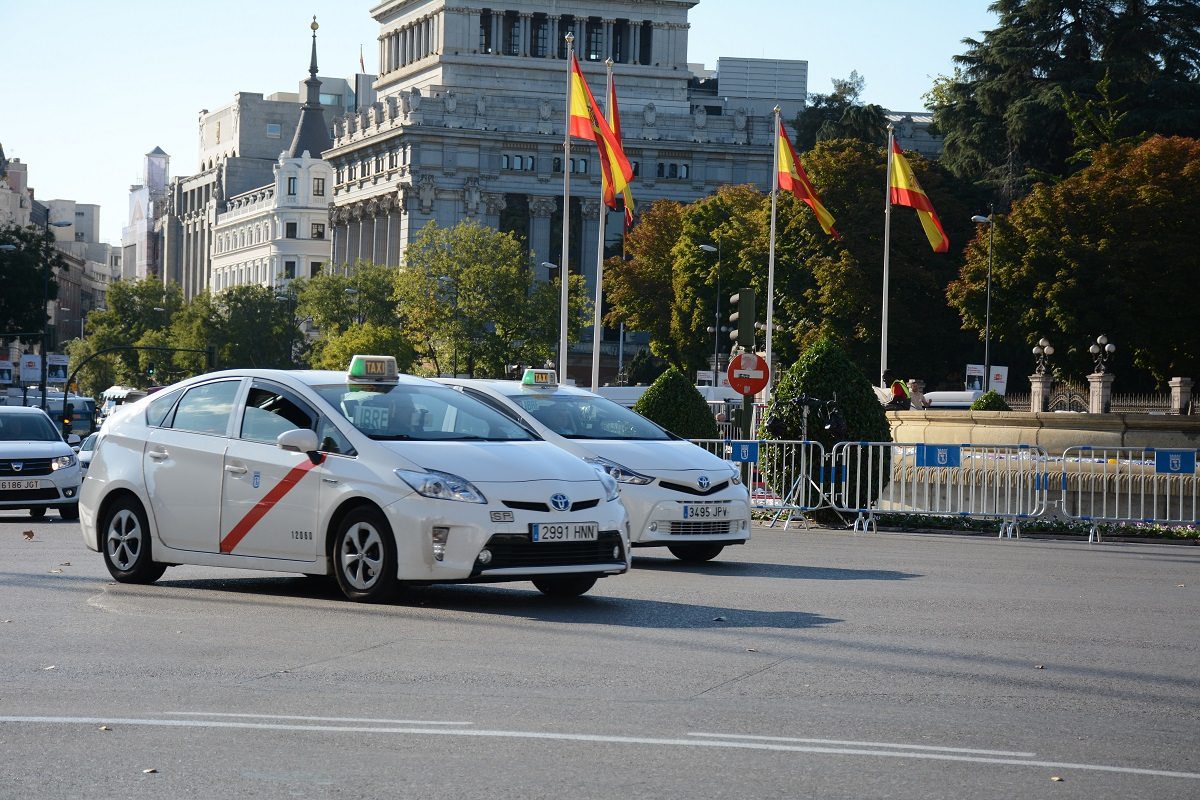 Madrid airport white taxis arriving at the airport