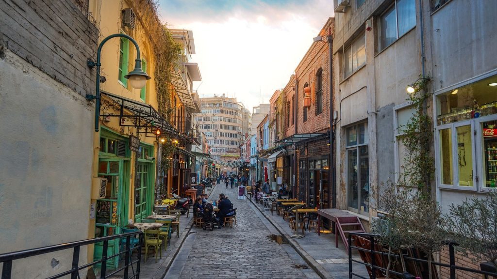 Thessaloniki Ano Poli Upper Town., cobbled street lined with cafes.