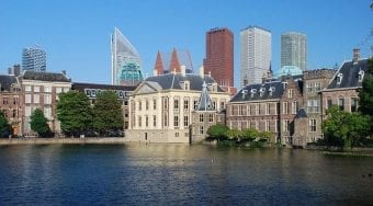 Modern and traditional buildings along the waterfront in The Hague.