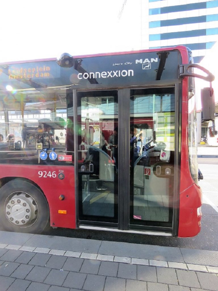 Connexxion bus 397 in Amsterdam waiting on the platform.
