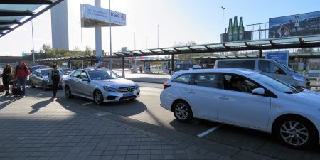 Amsterdam airport white taxis lined up