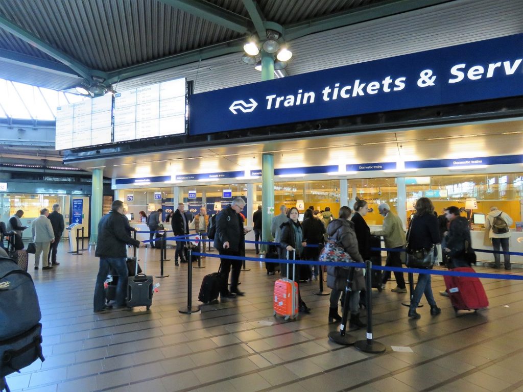 Amsterdam Airport train ticket counters at the station.