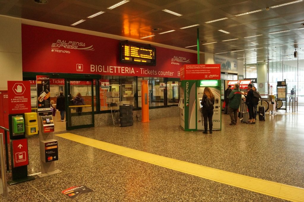 Milan Airport train station ticket counter for trips from Milan Airport to city center
