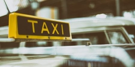 Yellow and black taxi roof sign