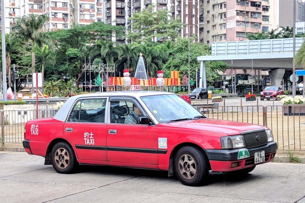 Urban-red Hong Kong airport taxi.