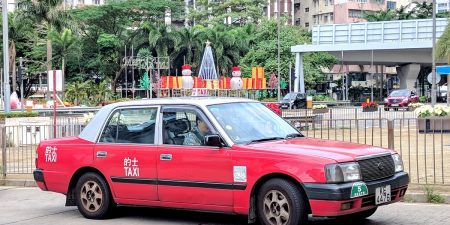 Urban-red Hong Kong airport taxi.
