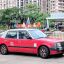 Urban-red Hong Kong airport taxi.