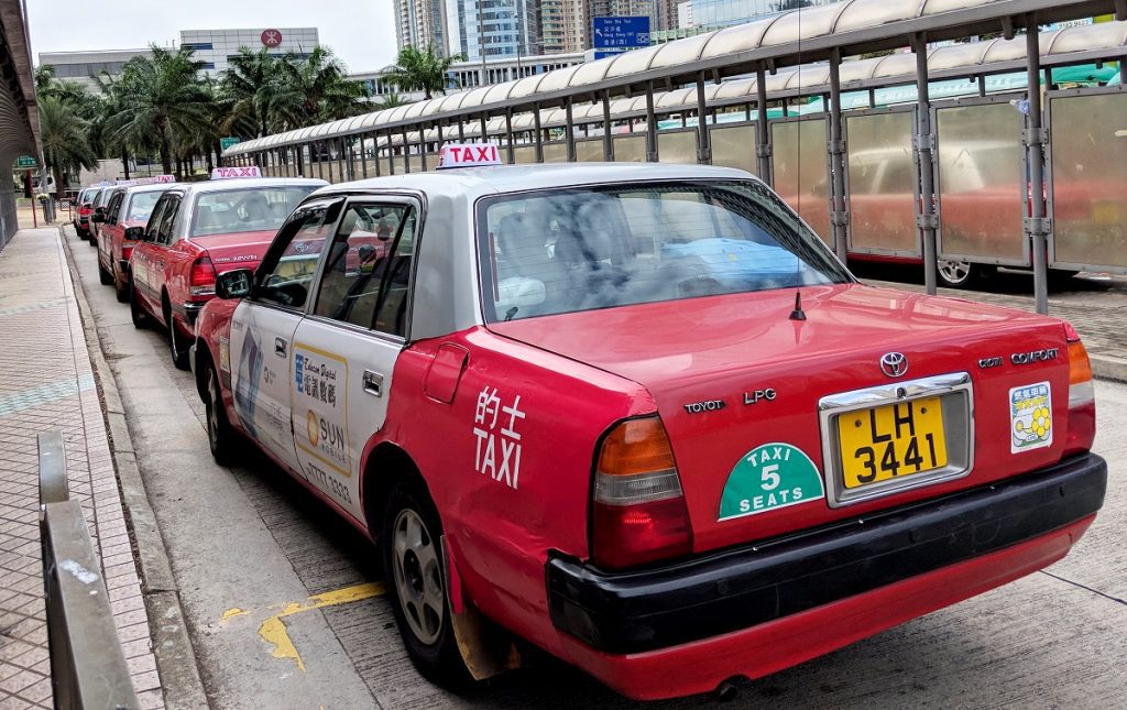 Urban-red Hong Kong airport taxis lined up