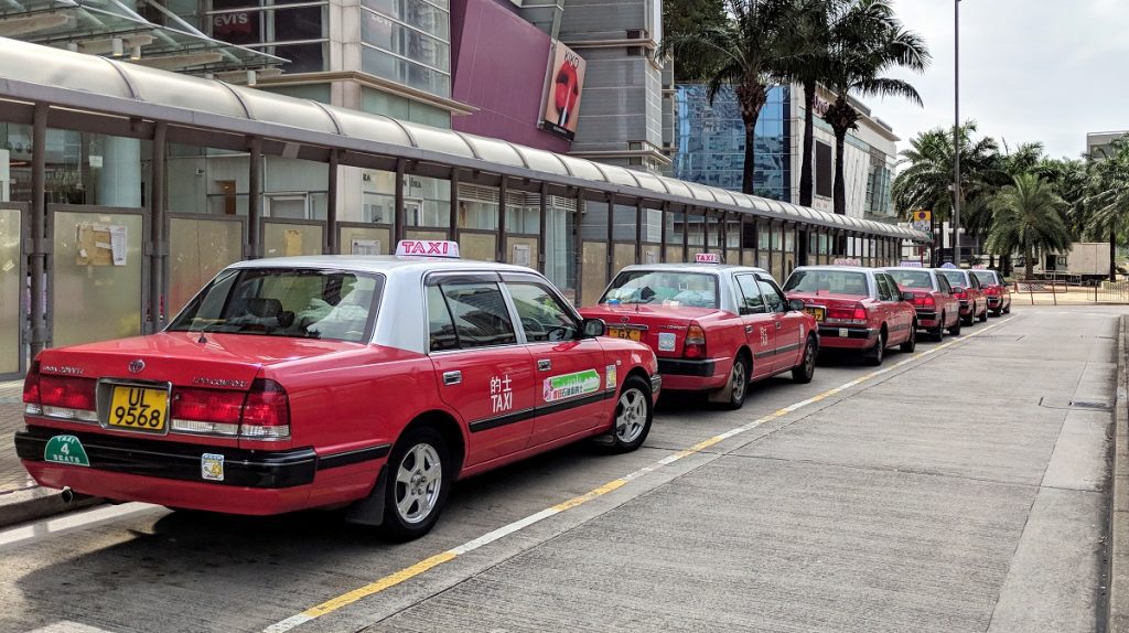 Urban-red Hong Kong airport taxis lined up