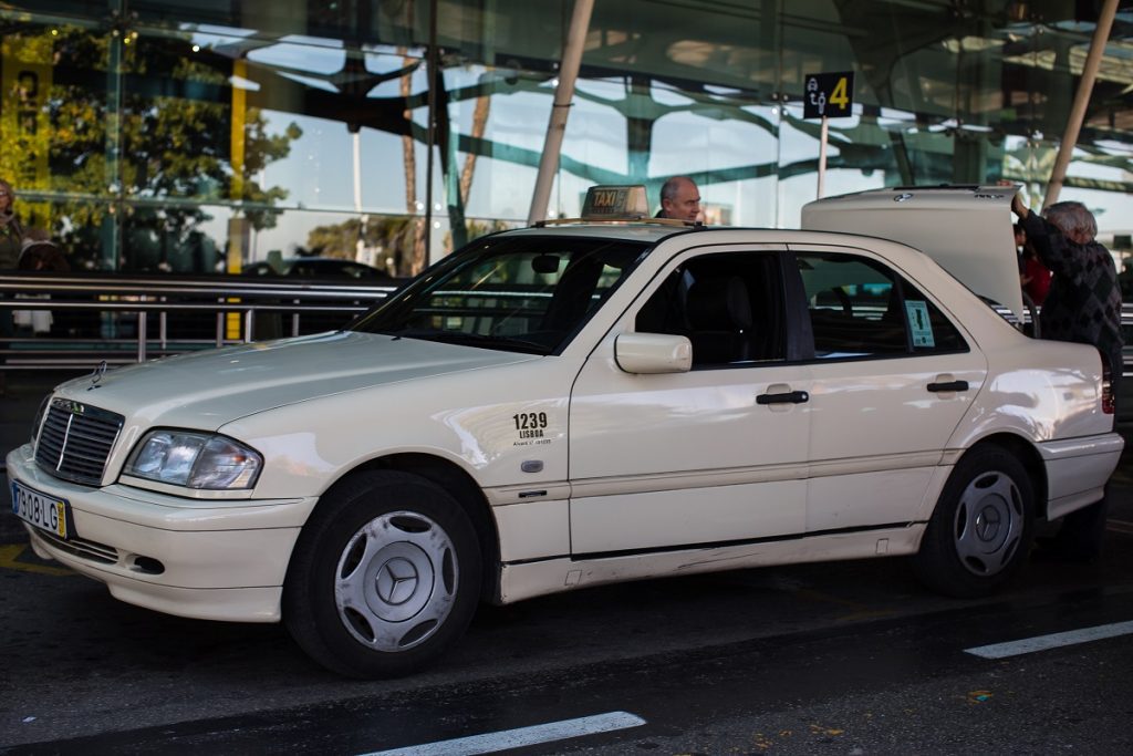 Lisbon airport white taxi