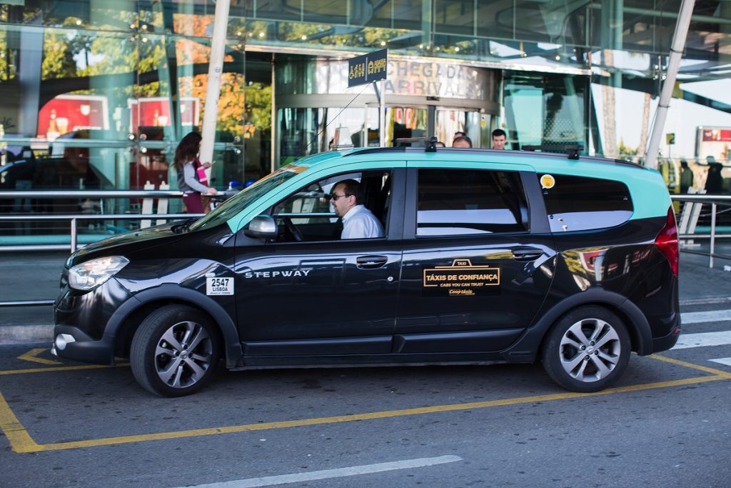 Lisbon Airport black minivan taxi