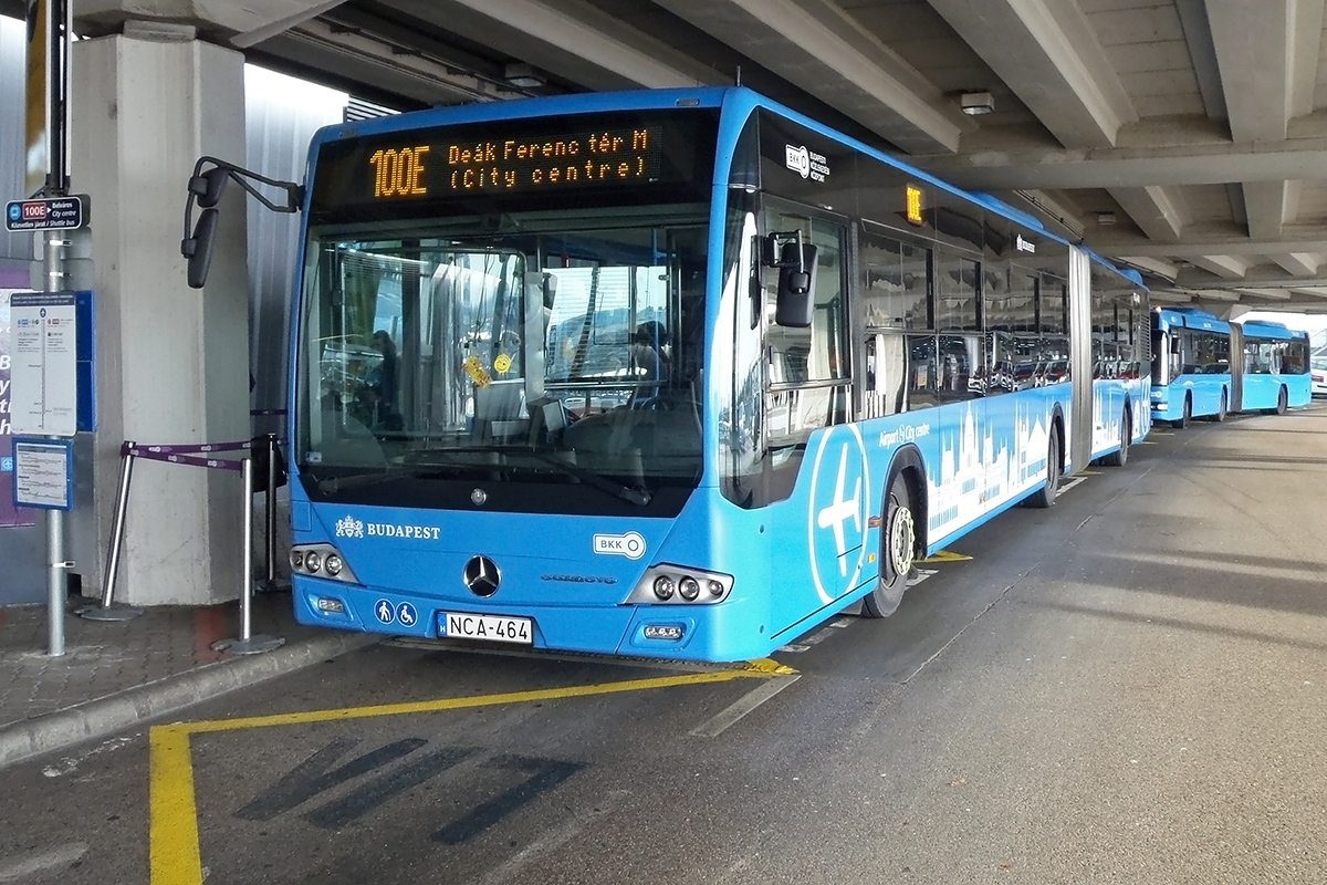 Public bus No. 100E waiting on the airport's platform