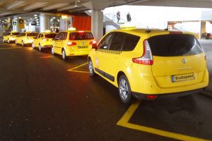 Budapest Airport taxis - Welcome Pickups Yellow Budapest Airport taxis lined up and waiting for passengers outside the terminal