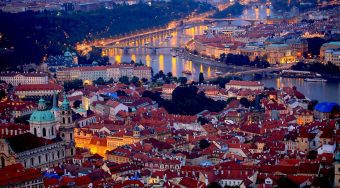 A view of Prague city lit up at night.