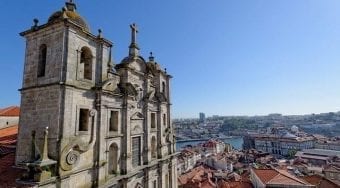 A view of an old, ornamental building looking out over the city of Porto.