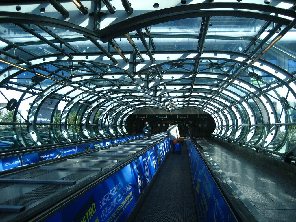 A picture of a walkway tunnel used for Malpensa Airport departures