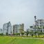 View of Miraflores, tall buildings with grass and a path in front.
