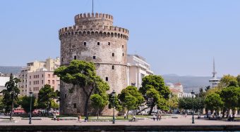 Round Thessaloniki building with small window outlets and a scalloped roof.
