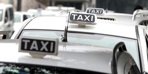 White taxis in Naples lined up