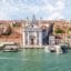 View of Santa Lucia Station in Venice, with a body of water filled with Venice water taxis and ferries.