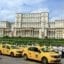 Bucharest taxis in front of the Palace of Parliament.