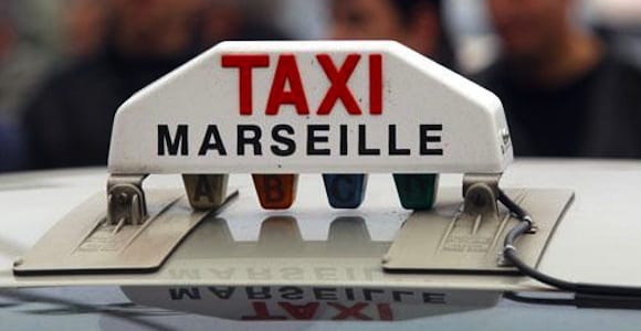 Marseille Airport Taxi-Welcome pickups The ‘Taxi’ sign on the roof of a Marseille Airport taxi.