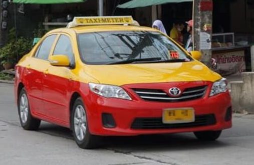 Phuket taxi red and orange taxi in phuket thailand