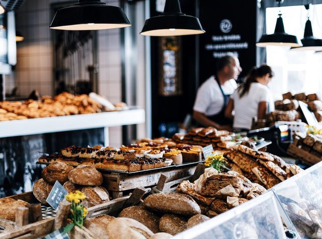 close up of breakfast cakes and sandwiches in a cafe