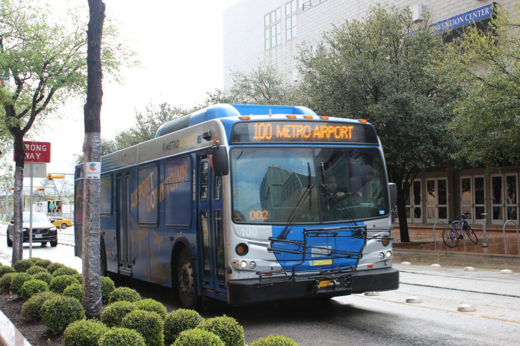 blue and white airport bus in austin texas