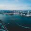 Aerial view of San Diego and it's blue ocean and skyscrapers rising in the background.