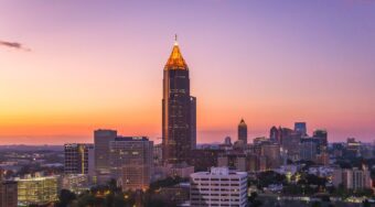 Midtown Atlanta skyline at sunset transforming the blue sky to various shades of pink and purple