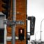 red man on black traffic light near red brick wall in daytime in Adelaide SA, Australia