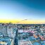 aerial photo of city buildings in New Orleans featuring a yellow and blue sky during sunset