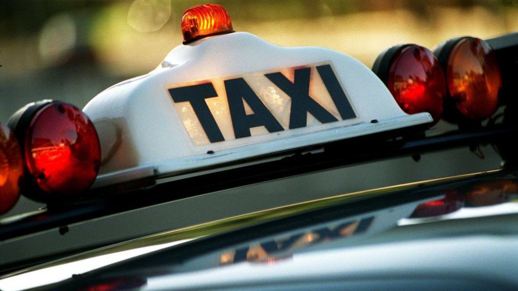 Gold Coast taxi cab roof with taxi sign in Gold Coast