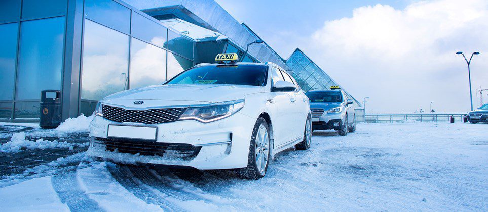 Reykjavik taxi silver and grey taxis outside Reykjavik's snowed down airport