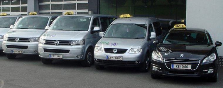 Salzburg taxi silver and black taxis and minivans with signature signage on the roof