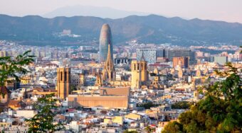 aerial view of Barcelona city with high rise modern buildings and houses