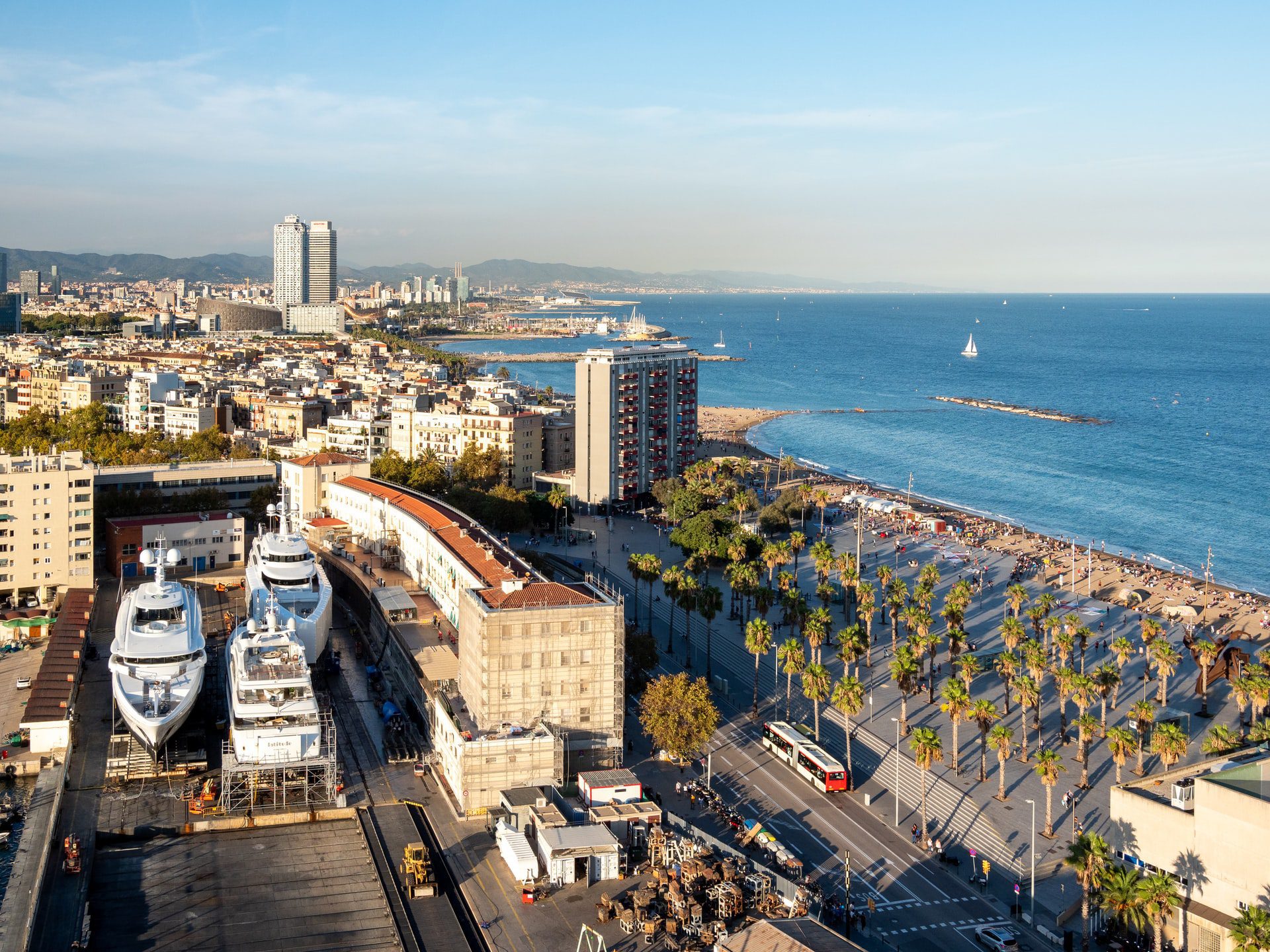 aerial view of city buildings near Barceloneta beach on a sunny day
