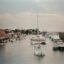 boats sailing in body of water in daytime