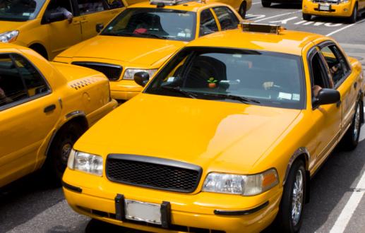 minneapolis taxi yellow taxis driving in the street in daytime
