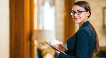 Photo,Of,Business,Woman,Holding, Clipboard,In,Expensive,Hotel.,Young,Business,Woman