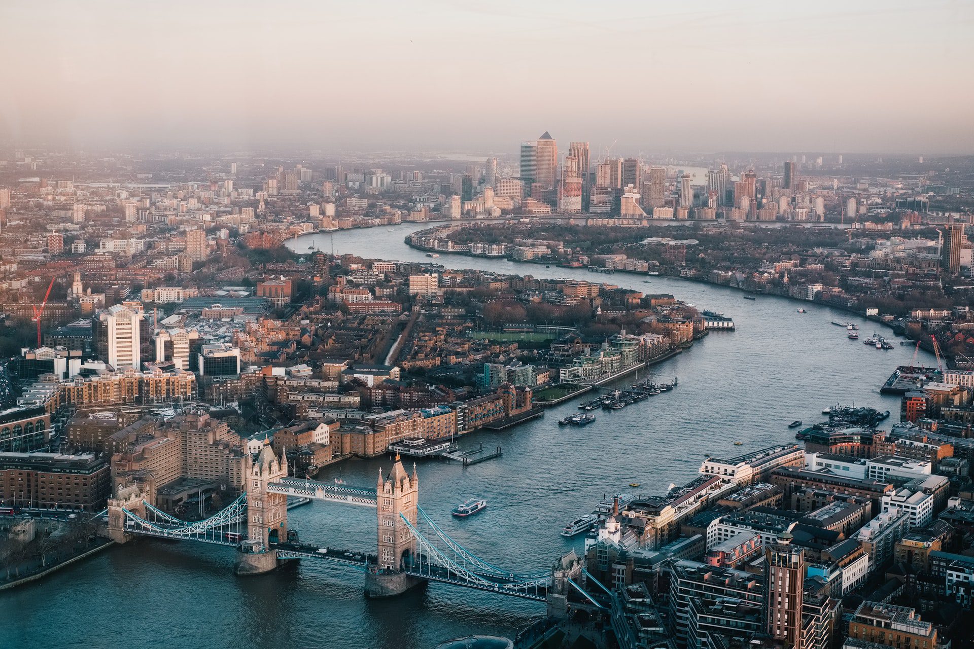 aerial view of the city of London with River Thames and Tower Bridge during daytime
