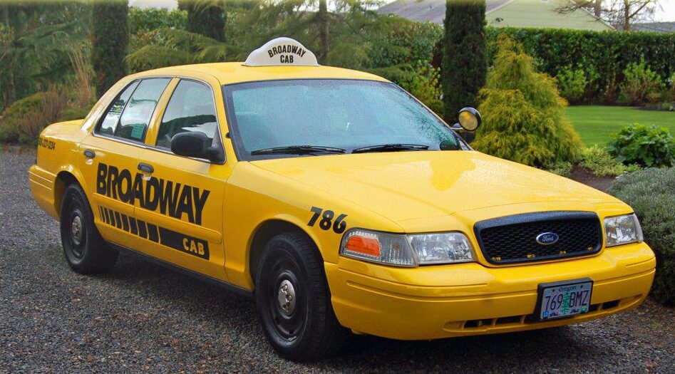 Portland taxi yellow taxi vehicle near forest