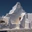 white concrete church building under a blue sky